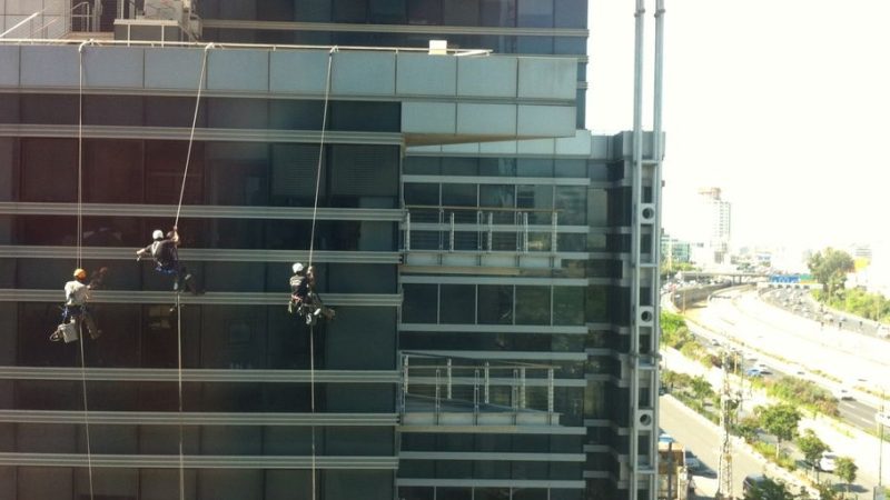 window washer cleaning high-rise building