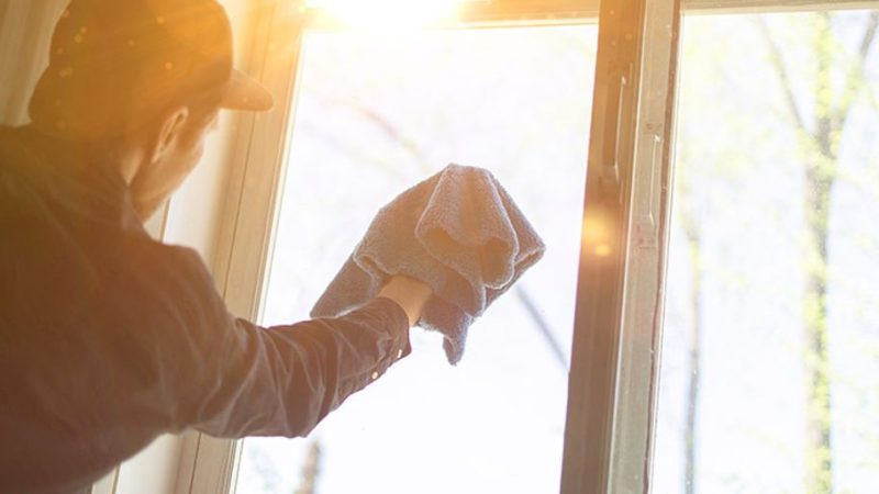 professional window cleaning service in a modern city