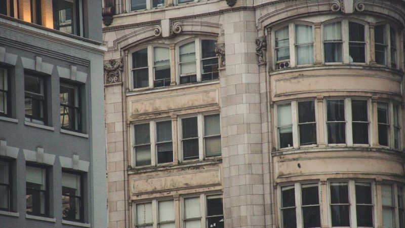 professional window washers cleaning high-rise building